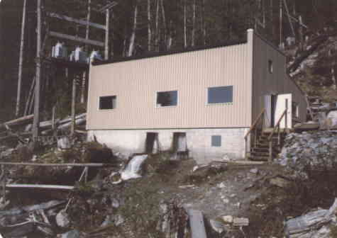 A concrete and steel power house contains the equipment.